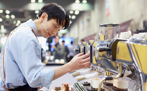 Hyun-young dials in a shot at a barista competition.