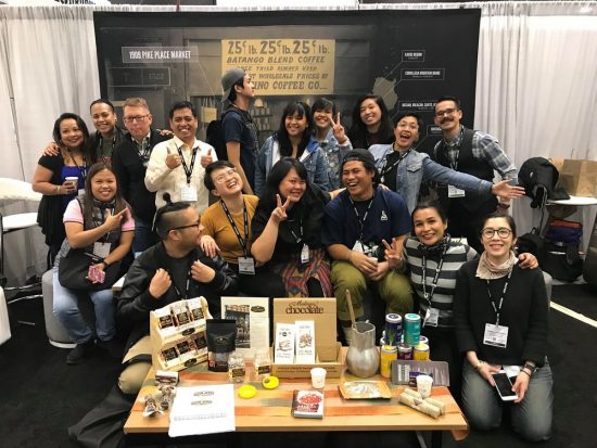 Another group photo of Kalsada at a table of coffee brewing devices.