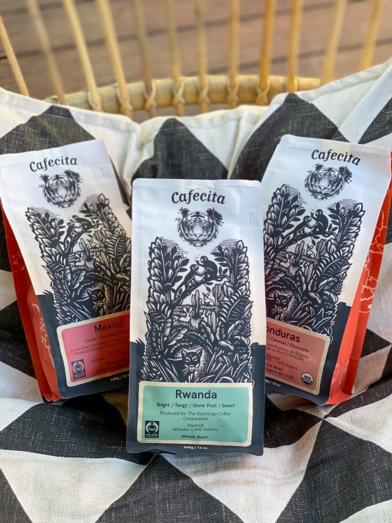 Coffee bags with Kill Joy's design of nature and a lion.