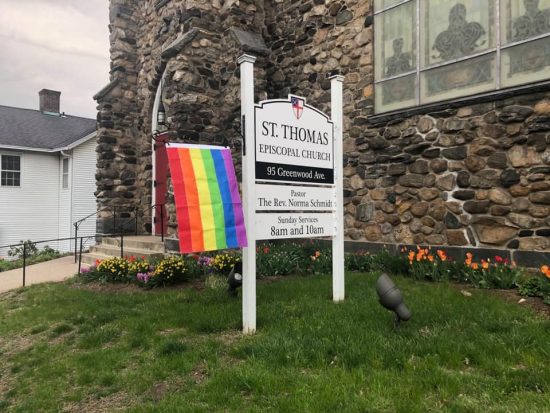 An episcopal church hangs a Pride flag in solidarity.