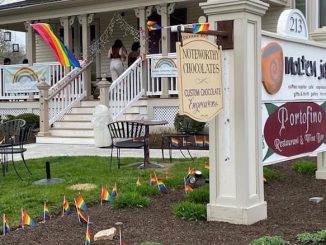 The storefront of Molten Java decorated with rainbow flags.