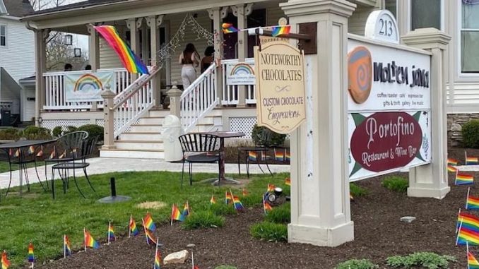 The storefront of Molten Java decorated with rainbow flags.