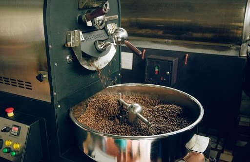 A closeup shot of a coffee roaster roasting beans.