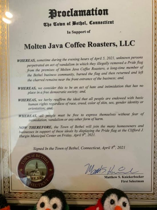 A business proclaims an annual hanging of the flag to honor the incident at Molten Java.