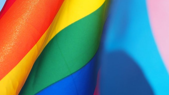 A closeup of a rainbow flag.