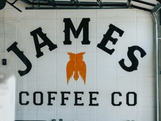The interior of a coffee shop with James Coffee Company written in big block font