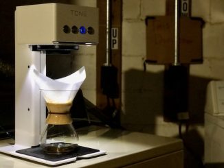 The touch tone brewer in a basement with a chemex underneath it.