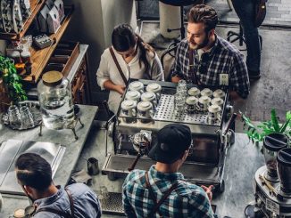 An aerial shot of baristas working at an espresso machine