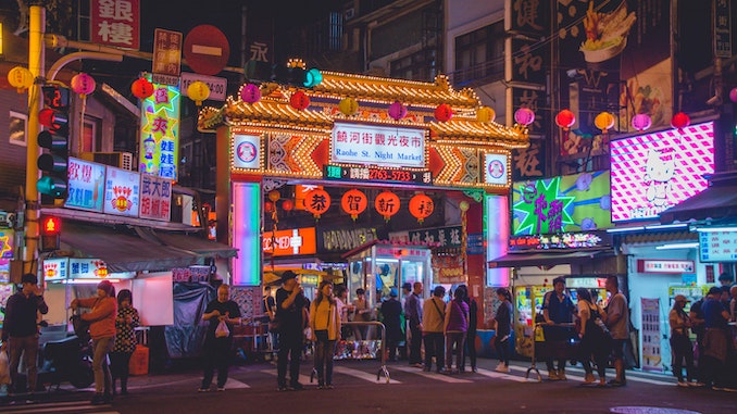 A bright sign in Taiwan in a city context.