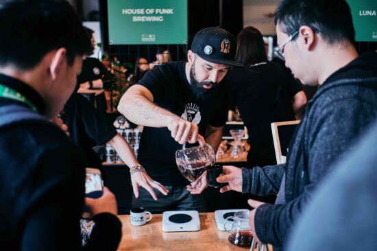 A coffee roasters serving samples at Beanstock in 2019.