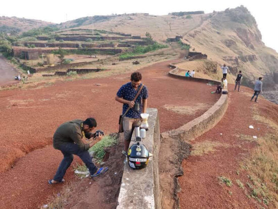 Filming a coffee set up on a wall in the port town of Ratnagiri.