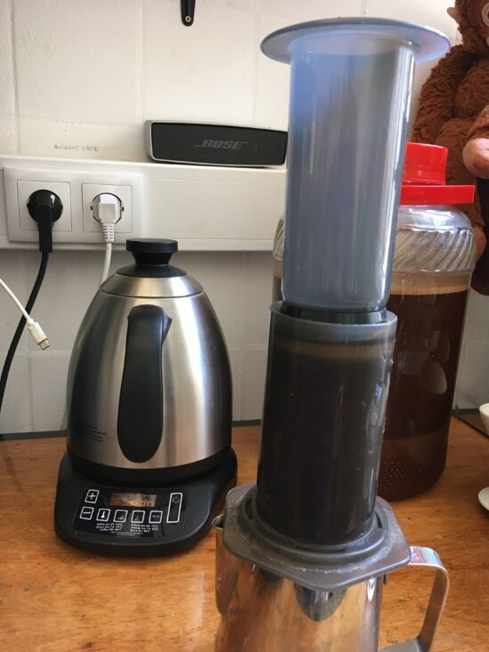 An AeroPress brewing coffee using the regular technique.