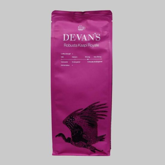 A fuchsia colored Robusta Kaapi Royale coffee bag by Devan's features a vulture in flight with its wings raised.