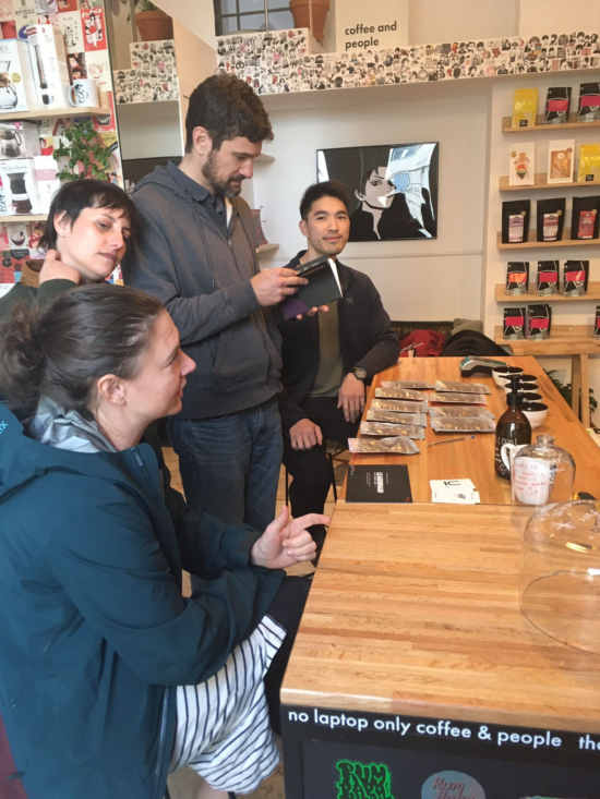 Four players gather around the table, ready to start the game.