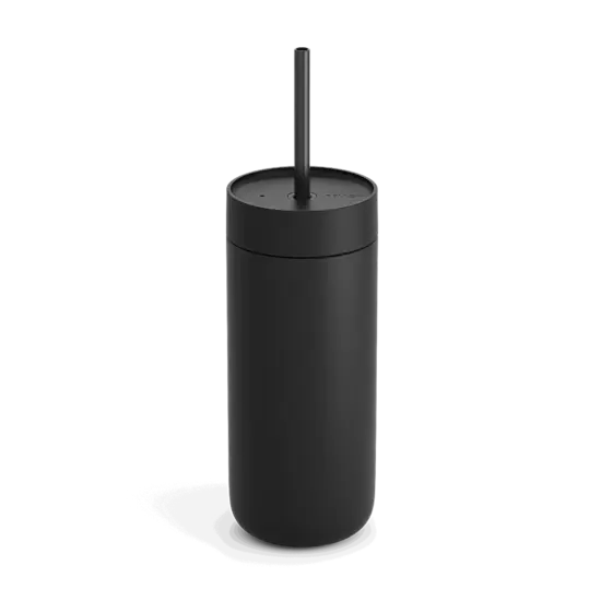 A tall and slender matte black to-go cup with a matching straw.