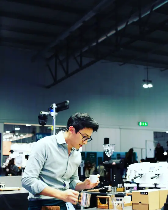 Barista champion of Brazil Boram Um prepares an espresso in a barista competition.