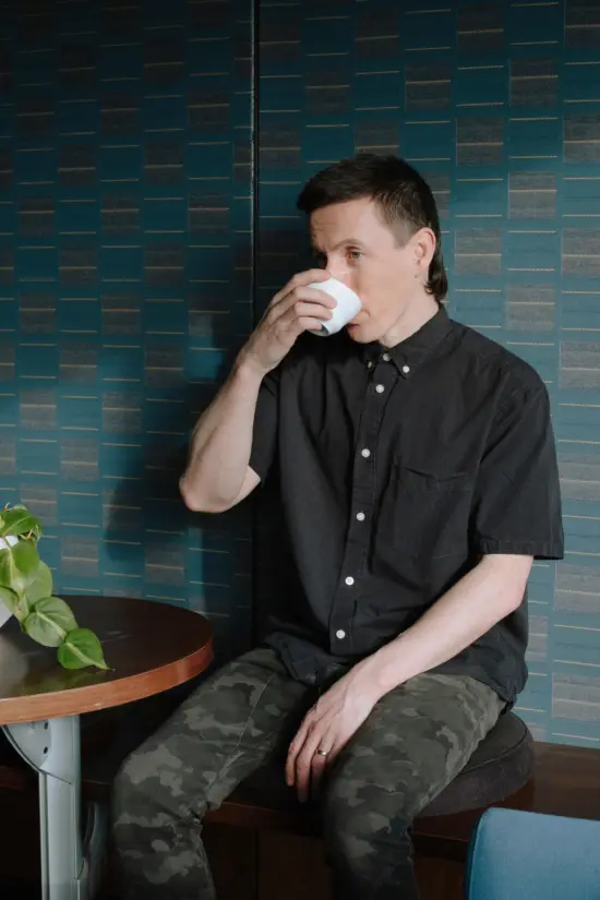 Ben Put of Canada drinks a coffee in Monogram Coffee.