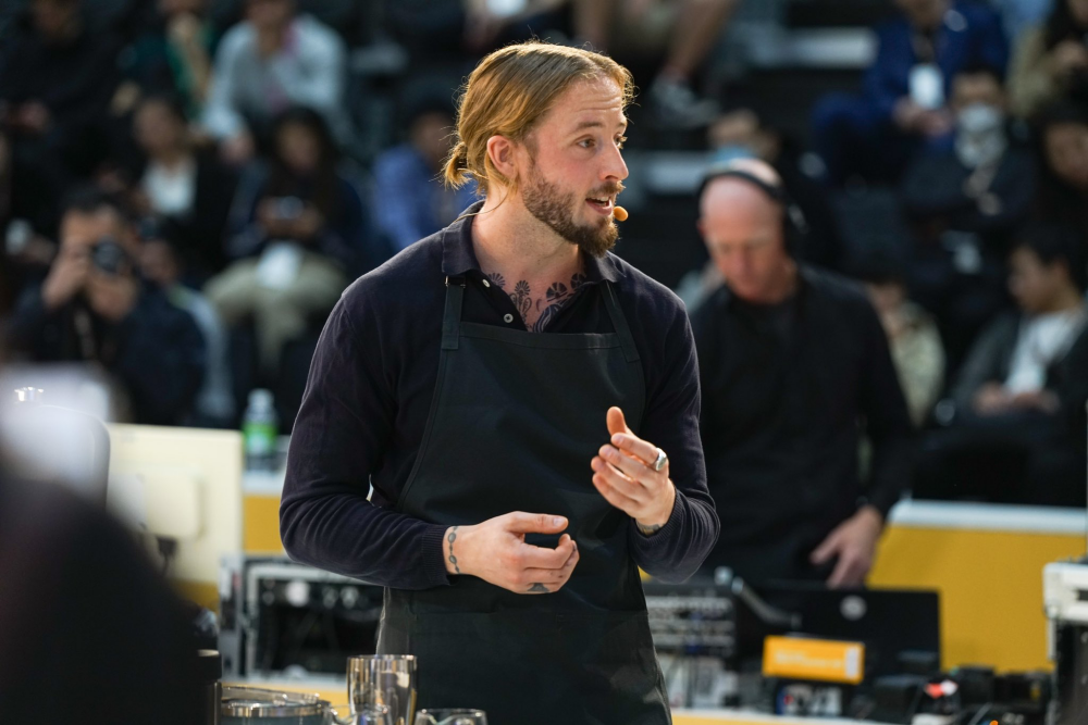 Patrik Rolf performs his barista competition routine in front of an audience.