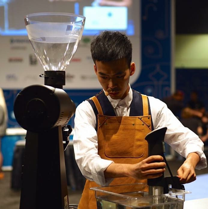 Dawn Chan works on creating a signature beverage during a barista competition.