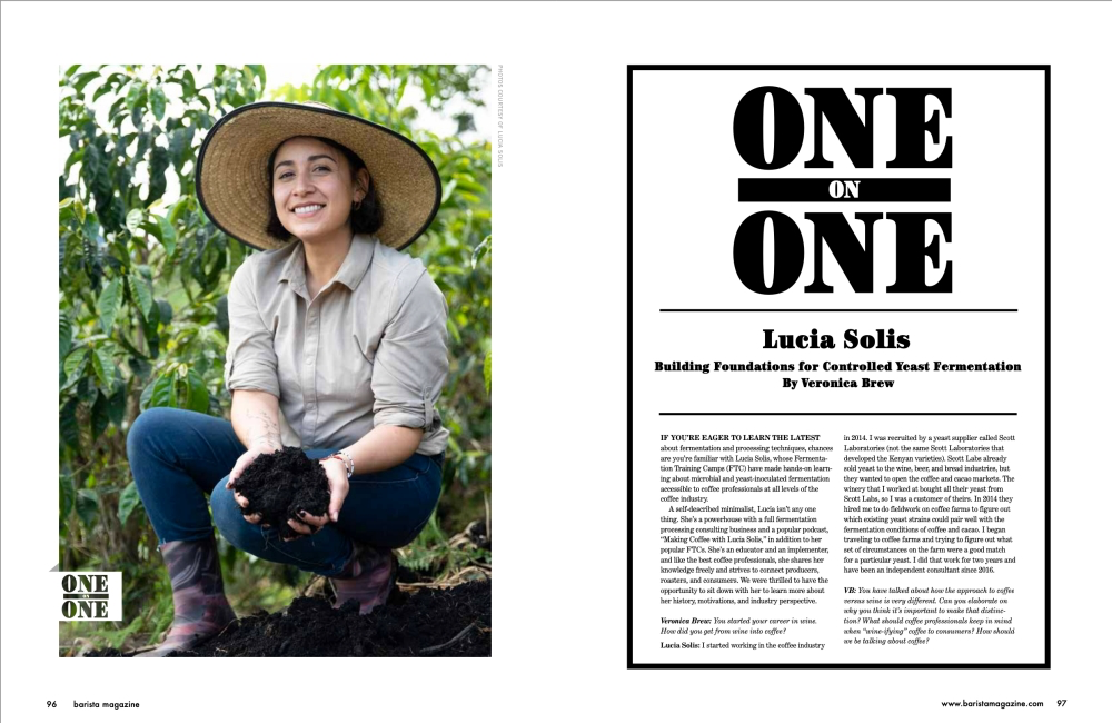The two-page opening to One on One with Lucia Solis. A photo of Lucia holding rich earth on a coffee farm is on the lefthand page. Title and text is on the righthand page.