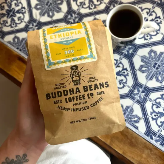 Bag of Buddha Beans next to a blue tile countertop.