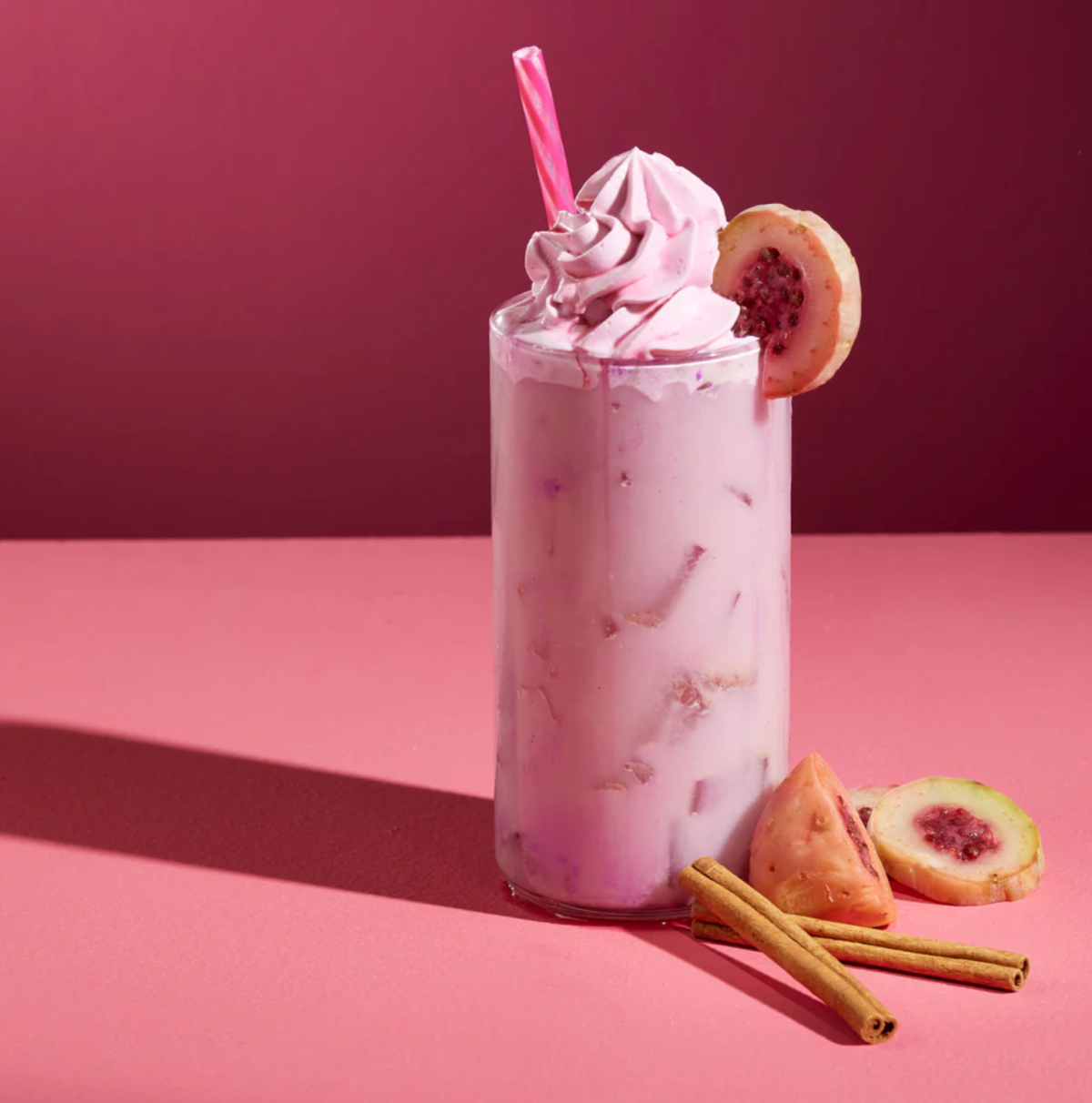 A glass of Prickly Pear horchata with whipped cream on top.