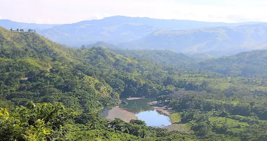 A view of Sigatoga Valley, a small body of water at the center surrounded by verdant forest.