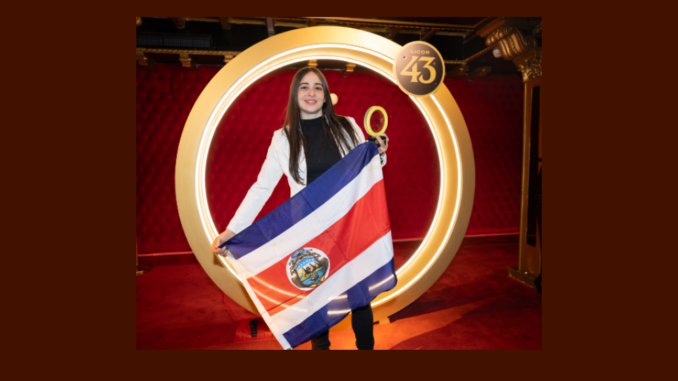 Gabriela Wong champion of the Bartenders & Baristas Challenge holding a Costa Rican flag.