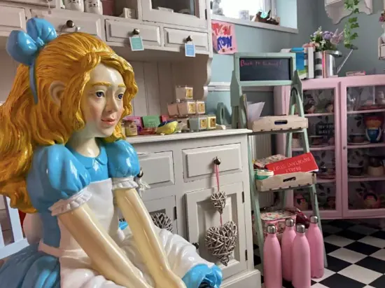 A statue of Alice inside the cafe.