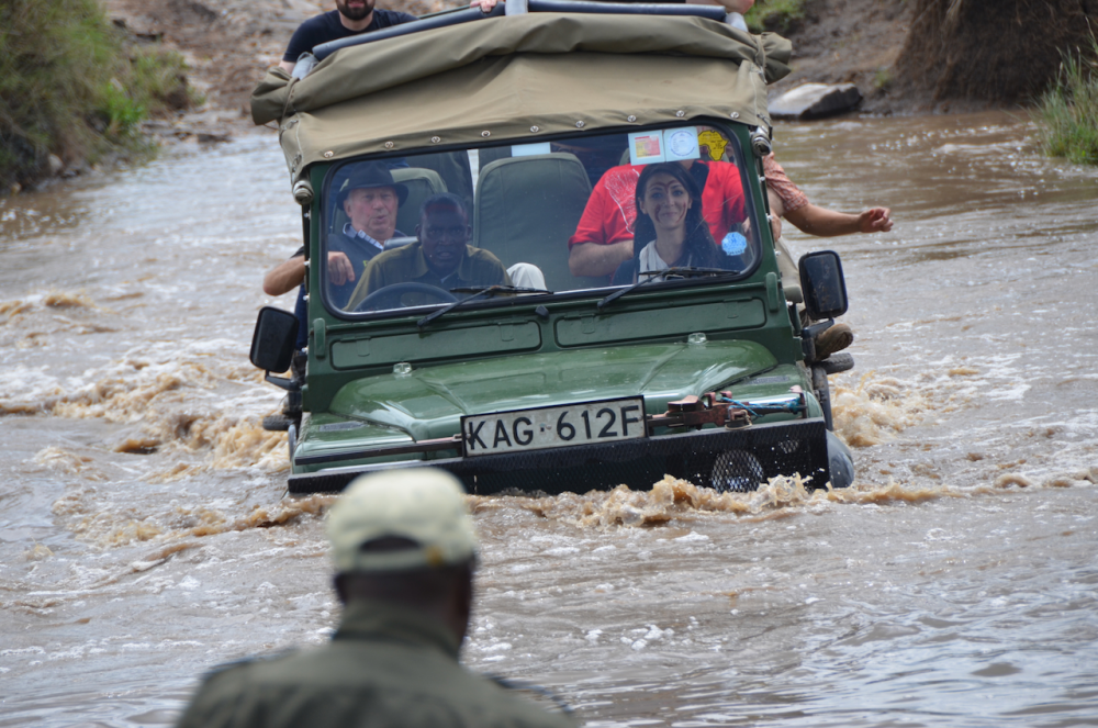 Gianni in a Land Cruiser crossing a flooded river
