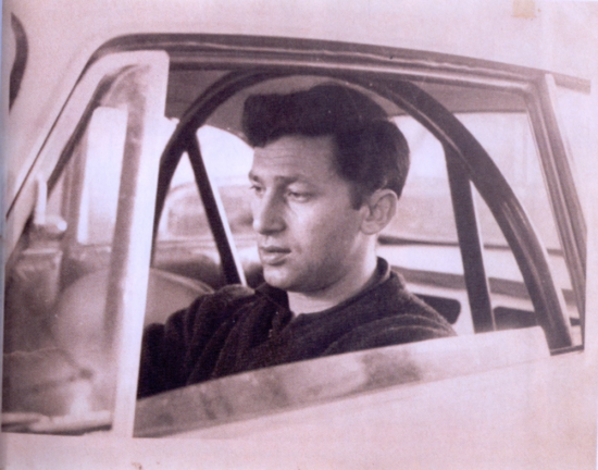 Gianni in the driver seat of his Alfa Romeo.