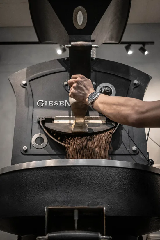 A roaster releases beans into the outer chamber while roasting.