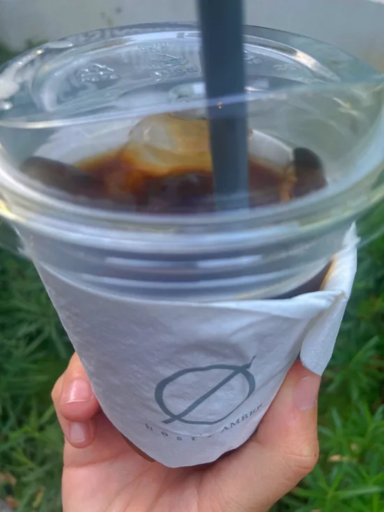 A to-go coffee cup with a logo.