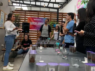 Denise Bustamente, owner of Hacienda Legrand, leading a robusta cupping.