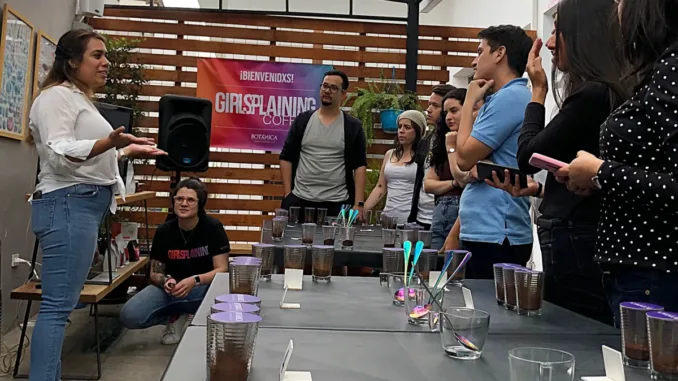 Denise Bustamente, owner of Hacienda Legrand, leading a robusta cupping.