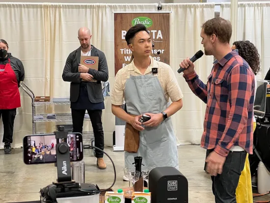 2023 U.S. Barista Champion Isaiah Sheese interviews Frank La after his performance at the 2024 U.S. Coffee Championships.