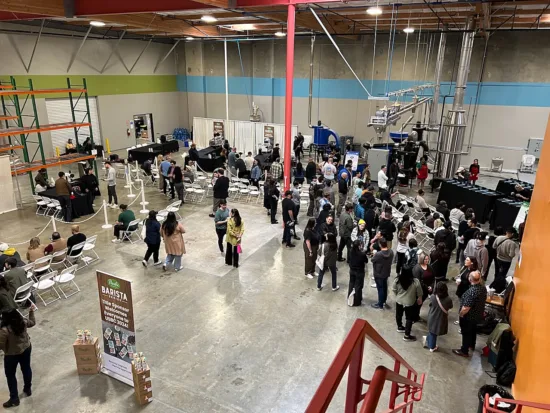 A wide shot of the warehouse holding the U.S. Coffee Champs competition.