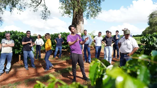 A group gathered at a coffee farm.