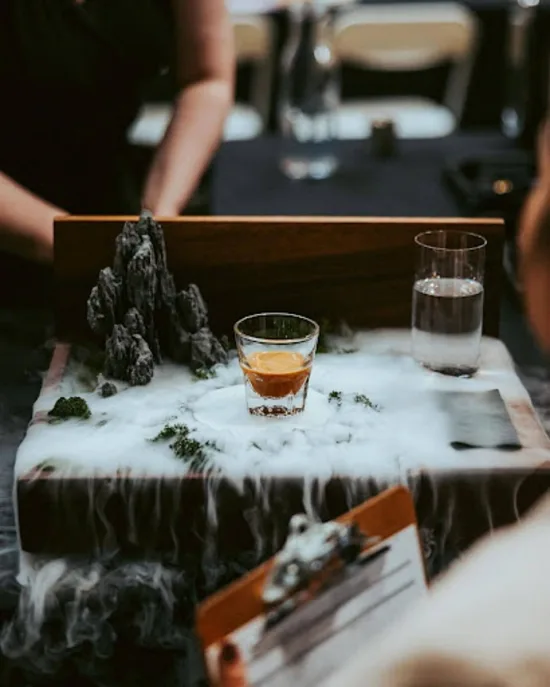 Barista competitor Morgan Eckroth's signature beverage on a custom serving platform which includes fog.