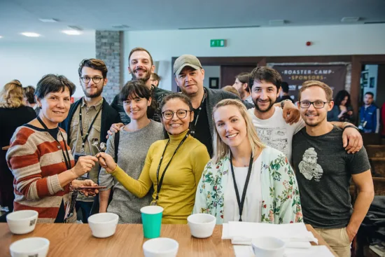 A group of people gathered around a cupping table.