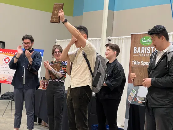 Winners circle: Frank covers his eyes with one hand and holds up his plaque with the other.