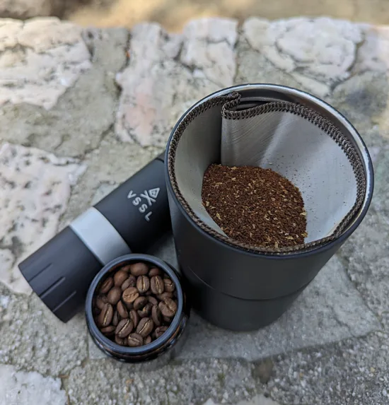 Ground coffee inside the reusable mesh filter.