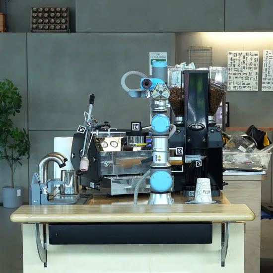 A light blue robot Jarvis is set on a coffee counter.