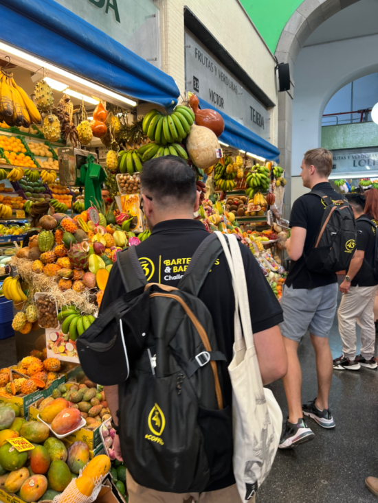 Contestants search for ingredients among a huge selection of fruits.