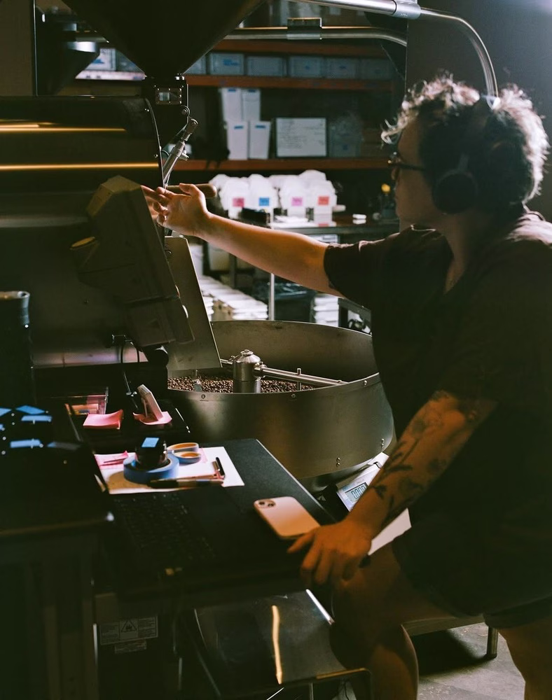 Café Even's head roaster, Pauline Menard, works quietly at the back of the coffee shop in Montreal.